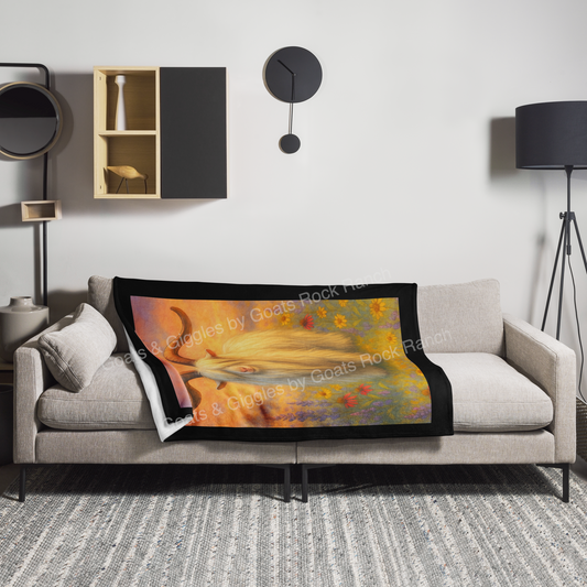 Colorful blanket with a scenic design heritage Mini Silky buck RNA Dillon draped over a gray sofa in a modern living room.